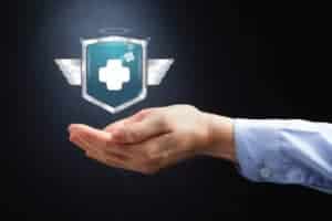 Picture Of Hands Presenting Self Insurance With Medical Icon