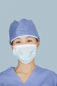 Close-up of female surgeon Class Code 8871 wearing face mask